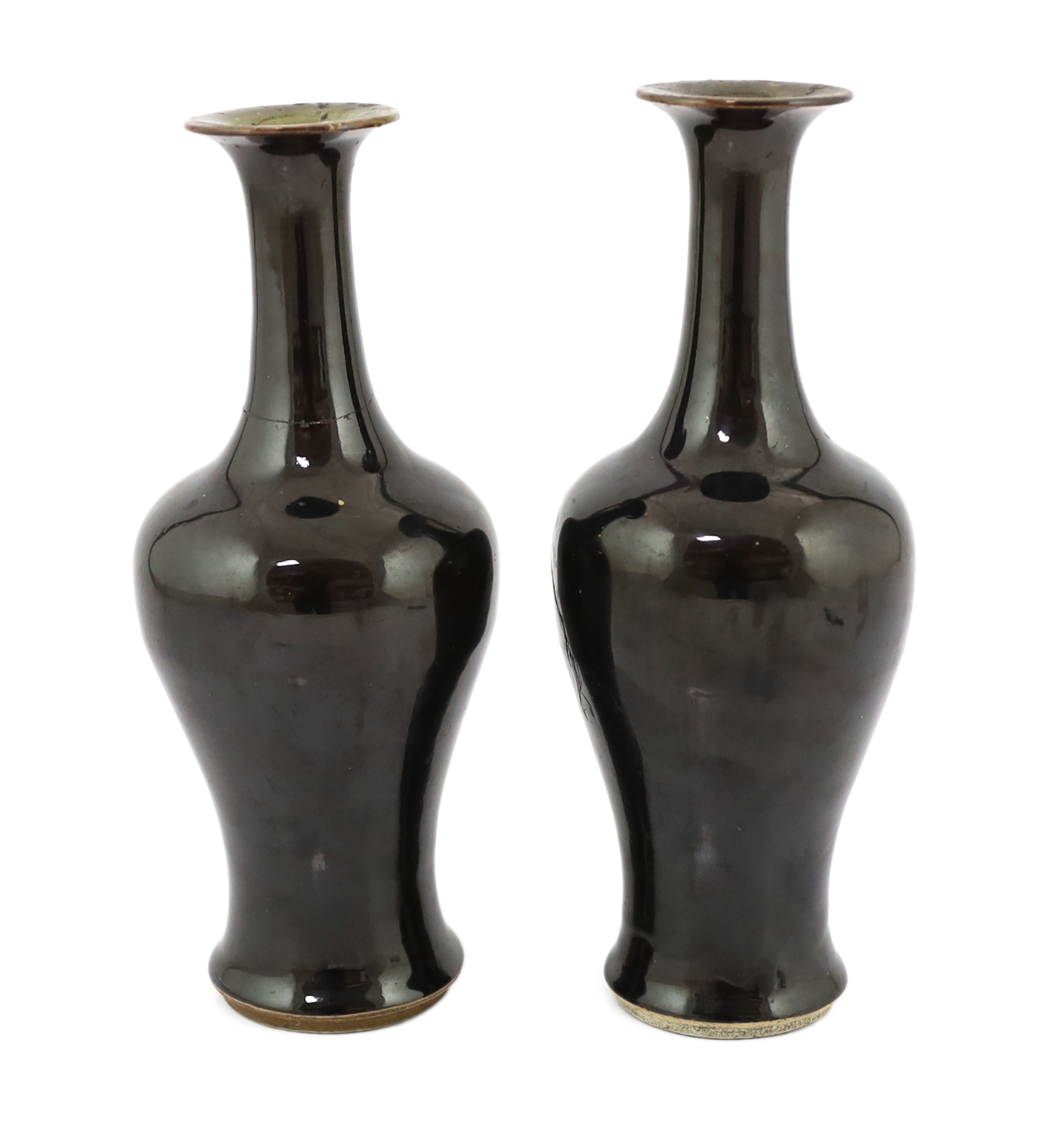 A near pair of Chinese mirror-black glazed vases, Kangxi period, both broken and glued